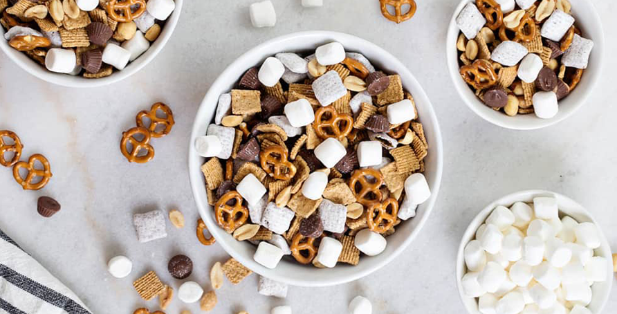 s'mores snack mix with pretzels, chocolate, puppy chow and marshmallows