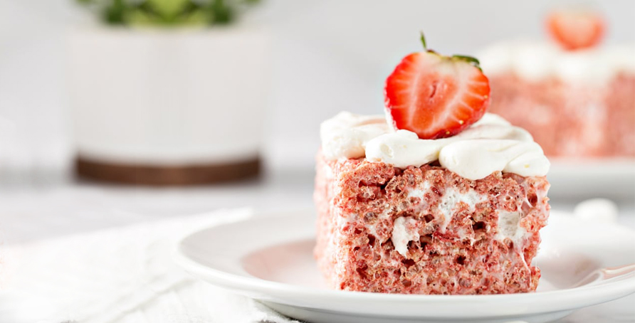 Strawberry Rice Krispie Treats on plate with plant in background