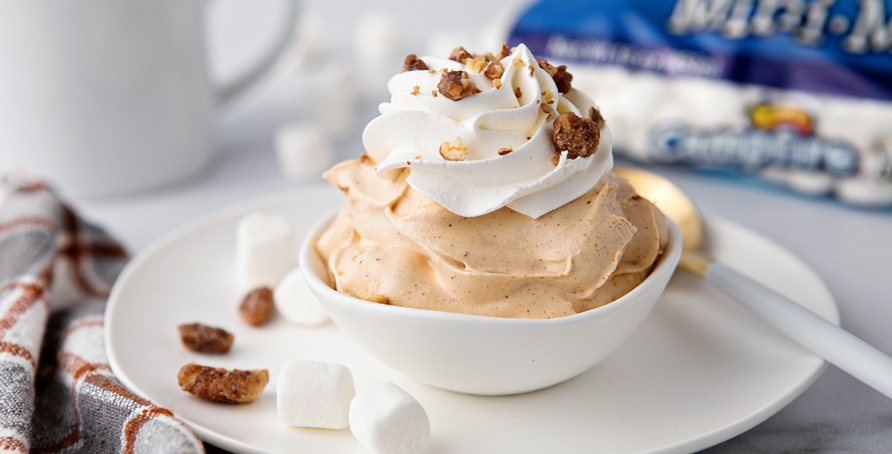 Pumpkin Spice Fluff in white dish with coffee, marshmallows and pecans